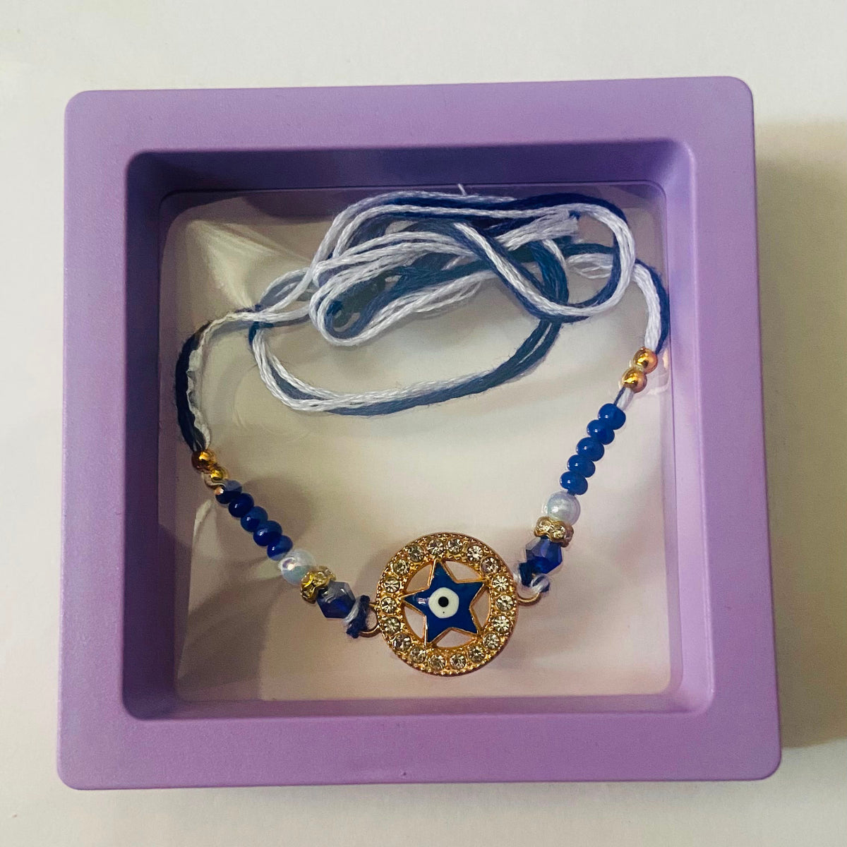 Blue Star Evil Eye Rakhi with Gold Accents