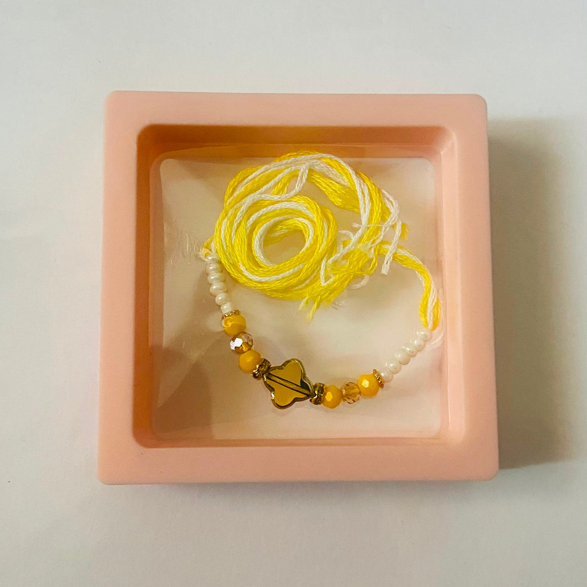 Yellow Butterfly Pearl Rakhi