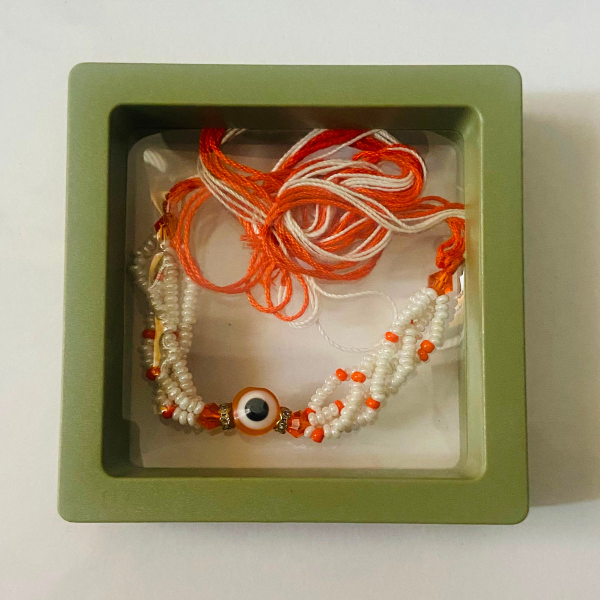 Orange Evil Eye Pearl Rakhi