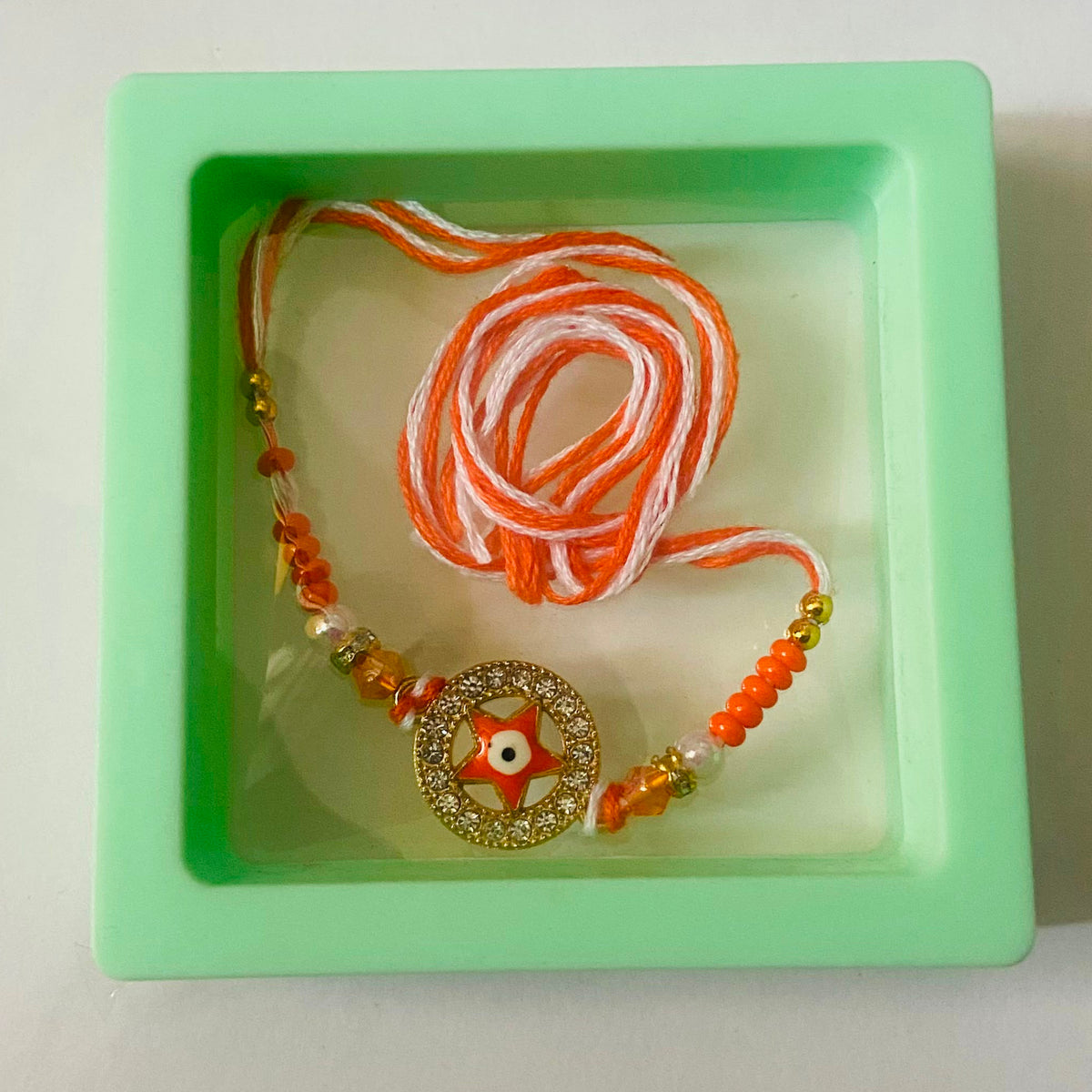 Orange Star Evil Eye Designer Rakhi